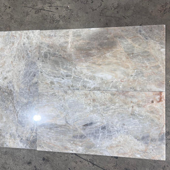Beige onyx natural stone tile, 12x24 polished surface from RN, showcasing smooth, glossy finish and elegant stone pattern.