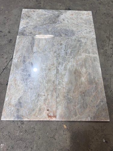 Beige Onyx 12x24 polished natural stone tile from RN, showcasing smooth, shiny surface and subtle beige veining.