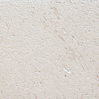 Brushed limestone tile by MosaicBros in 24x24 inch natural stone tile with a textured shell stone finish.