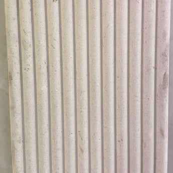 Honed Shellstone Myra fluted 12x24 limestone mosaic tile from SA, showcasing textured, natural stone surface with fluted design.