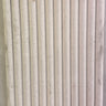 Honed Shellstone Myra fluted 12x24 limestone mosaic tile from SA, showcasing textured, natural stone surface with fluted design.