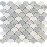 Natural stone tile by Roca featuring a blue mix, Carrara, and Thassos marble in a 12x12 fan-shaped mosaic pattern.