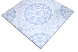 Close-up of Amelia Iris marble mosaic showing blue floral ornamental detailing