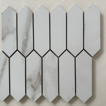 Calacatta polished marble picket mosaic tile featuring white marble with bold gray veining in a linear pattern