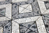 Close-up of grey terrazzo tile showing aggregate texture and pattern
