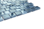 Crystal Aqua Stromboli Garden Blue glass mosaic tile installed on a bathroom shower wall with refreshing blue tones and reflective glass surfaces.