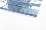 Crystal Aqua Sofia 2x3 glass mosaic tile installed on a bathroom shower wall with reflective glass surfaces and modern styling.