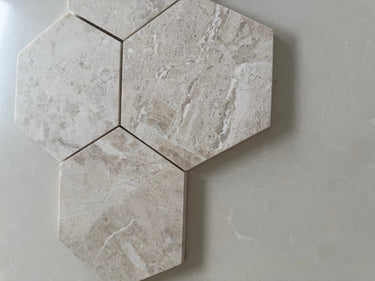 Diana polished hexagon marble tile used as a kitchen backsplash