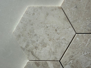 Diana marble hexagon mosaic tile installed on a luxury bathroom floor