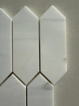 Dolomite picket honed marble mosaic installed as an elegant kitchen backsplash with soft matte finish