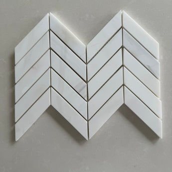 Dolomite polished 1x4 chevron marble mosaic tile featuring white marble and subtle gray veining