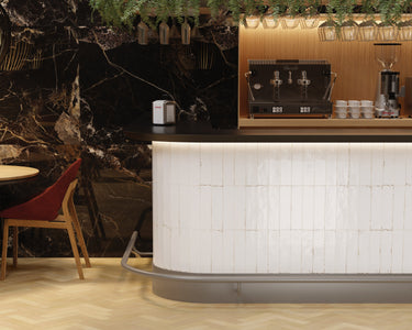 Dune Agadir Niebla Bright porcelain wall tile installed as a kitchen backsplash