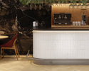 Dune Agadir Niebla Bright porcelain wall tile installed as a kitchen backsplash