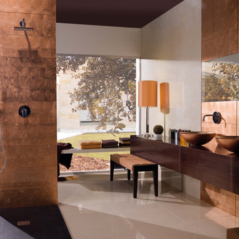 Copper-inspired glass wall tile creating a dramatic feature wall