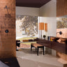 Copper-inspired glass wall tile creating a dramatic feature wall
