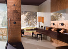 Copper-inspired glass wall tile creating a dramatic feature wall
