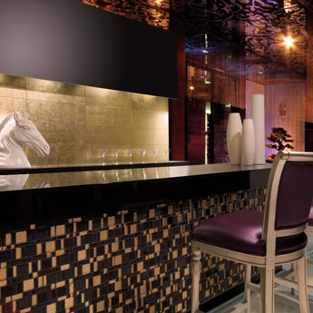 Decorative metallic glass tile installed as a luxury accent wall