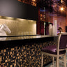 Decorative metallic glass tile installed as a luxury accent wall
