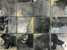 Mediterranean-inspired glazed porcelain backsplash in deep carbon tones
