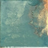Artisan-look emerald porcelain tile installed on a bathroom wall
