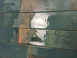 Mediterranean-inspired glazed wall tile featuring rich green tones
