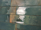 Mediterranean-inspired glazed wall tile featuring rich green tones
