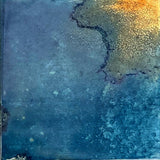 Artisan-look blue porcelain tile installed on a bathroom wall
