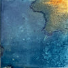 Artisan-look blue porcelain tile installed on a bathroom wall
