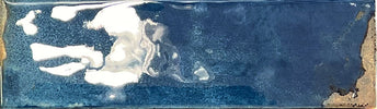 Artisan-look blue porcelain tile used on a shower wall
