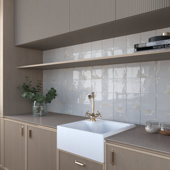 Glossy ivory porcelain tile creating a bright decorative feature wall