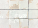 Artisan-look porcelain tile installed on a bathroom wall
