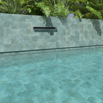 Teal anti-slip porcelain tile installed around a luxury swimming pool
