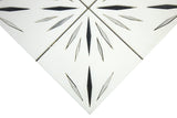 Close-up of Mythology Tile Harmony White Waterjet Marble Mosaic tile showcasing white and black marble pattern.