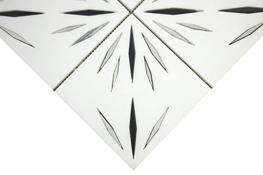 Close-up of Mythology Tile Harmony White Waterjet Marble Mosaic tile showcasing white and black marble pattern.