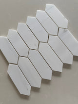 Close up of Dolomite honed marble picket mosaic showing natural veining and smooth matte surface texture