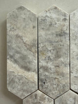 Honed Silver Travertine mosaic tile installed on a bathroom feature wall