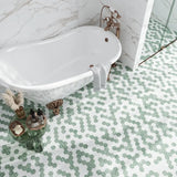 Close-up of Kerry Natural Stone Mosaic Tile by Mir showing textured, earthy stone pieces arranged in a mosaic pattern.