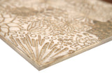 Close-up of Lidya Garden white marble mosaic tile showcasing textured, intricate design by Mythology Tile.