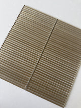 Lux Bronze 12x12 fluted glass mosaic wall tile by Roca, showcasing a textured bronze finish for modern backsplash designs.