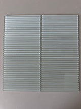 Lux Opal 12x12 flutted glass mosaic wall tile by Roca with textured, shimmering surface for elegant shower wall decorating.