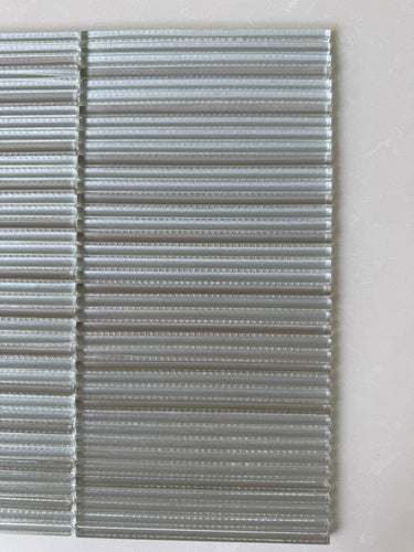 Roca Lux Sand 12x12 flutted glass mosaic tile for shower wall, featuring textured, sandy-toned glass tiles for modern bathroom decor
