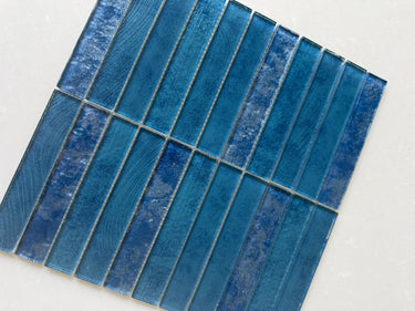 Roca Sapphire 12x12 stacked mosaic wall tile featuring vibrant blue glass tiles arranged in a modern stacked pattern.