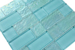 Crystal Aqua Osaka Maldives Green glass mosaic tile used as a kitchen backsplash featuring a decorative multiangular geometric pattern and tropical-inspired tones.