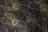 Close-up of Mythology Tile Golden Blossom Nero 18x18 floral mosaic tile with detailed black floral pattern and textured surface.