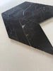 Premium polished black marble mosaic tile featuring a contemporary chevron pattern