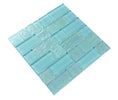 Pool-rated Crystal Aqua Osaka Maldives Green glass mosaic tile installed on a luxury swimming pool waterline with tropical aqua color variation.