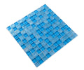 Pool-rated Crystal Aqua Osaka Sky Blue 1x1 glass mosaic tile installed on a luxury swimming pool waterline with bright blue color variation.