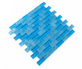 Pool-rated Crystal Aqua Osaka Sky Blue 1x2 glass mosaic tile installed on a luxury swimming pool waterline with bright blue color variation.