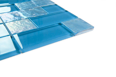 Crystal Aqua Osaka Sky Blue multangular glass mosaic tile installed on a bathroom shower wall with reflective glass surfaces and geometric styling.