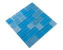 Pool-rated Crystal Aqua Osaka Sky Blue glass mosaic tile installed on a luxury swimming pool waterline with vibrant blue color variation.
